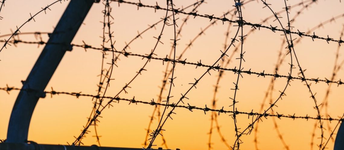 Sunset,Sky,And,Barbed,Wire